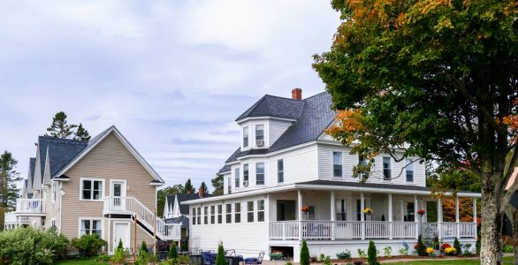 Summer-Exterior-of-Bay-of-Fundy-Hotel-for-Sale-Canada Exterior image of St. Martins New Brunswick Inn for sale